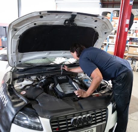 mechanic checking engine in Audi-Kelly’s Automotive Whangarei