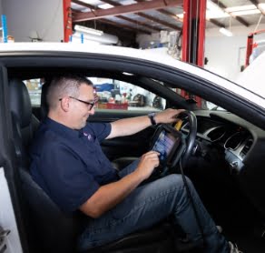 mechanic using diagnostic tools-Kelly’s Automotive Whangarei